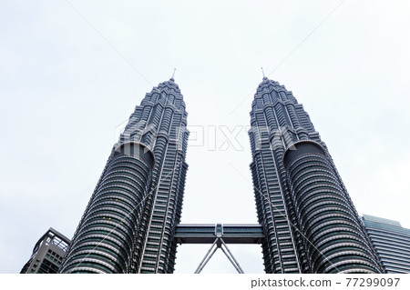 View of The Petronas Twin Towers in Kuala Lumpur, Malaysia. View of The Petronas Twin Towers in Kuala Lumpur, Malaysia. 77299097