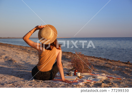 girl resting on the beach 77299330