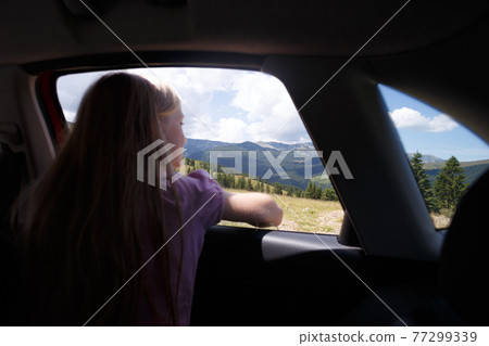 girl traveling in a car 77299339