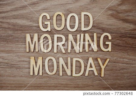 Good Morning Monday text message on wooden background Good Morning Monday text message on wooden background 77302648
