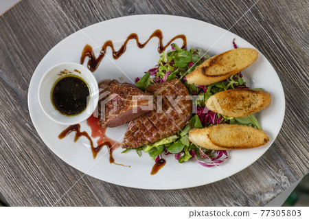 grilled duck breast with honey sauce and salad grilled duck breast with honey sauce and salad 77305803