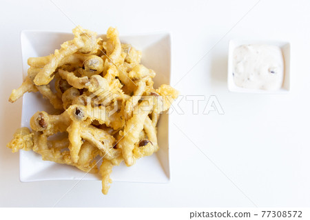 French fries that made by mushroom with dip sauce on white table background 77308572
