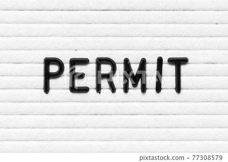 Black alphabet letter in word permit on white felt board background 77308579