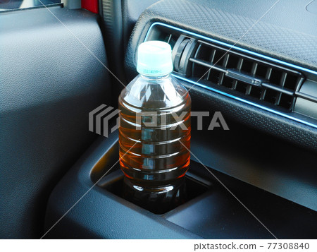 Drink holder in the instrument panel of a car Drink holder in the instrument panel of a car 77308840