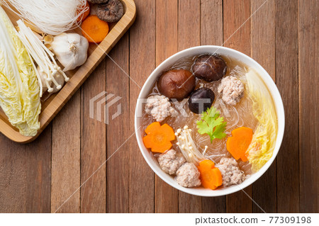 Clear glass noodle soup with Minced Pork,Vegetables and Shiitake Mushroom (Gaeng Jued Woon Sen).Top view 77309198