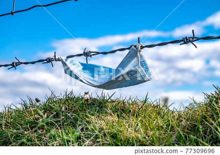 Mask in Fence at the Silver Strand in County Donegal - Ireland 77309696