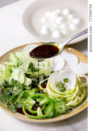 Green raw vegetables and herbs for salad Green raw vegetables and herbs for salad 77309738