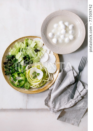 Green raw vegetables and herbs for salad Green raw vegetables and herbs for salad 77309742