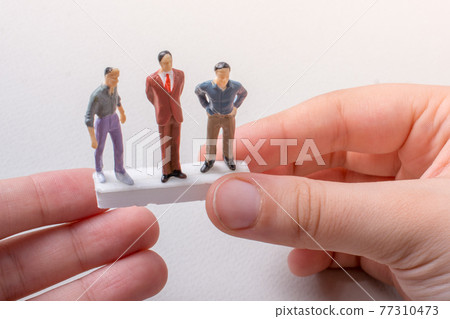 Tiny figurines of men model in view Tiny figurines of men model in view 77310473