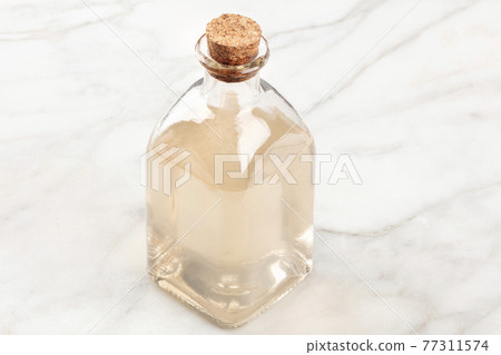 A photo of a corked bottle of homemade rose water face toner 77311574