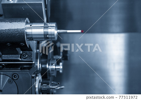 The touching probe in the tooling magazine. The touching probe in the tooling magazine. 77311972