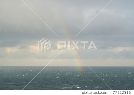 Rainbow over the sea 77312516