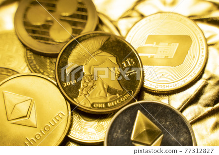 Gold crypto coins on a golden background. Trading on the cryptocurrency exchange. Cryptocurrency Stock Market Concept. Virtual money concept. Mining or blockchain technology. Business concept. Gold crypto coins on a golden background. Trading on the cryptocurrency exchange. Cryptocurrency Stock Market Concept. Virtual money concept. Mining or blockchain technology. Business concept. 77312827