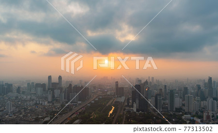 Aerial view of Bangkok Downtown Skyline, Thailand. Financial district and business centers in smart urban city in Asia. Skyscraper and high-rise buildings at sunset. 77313502