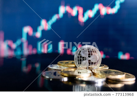 Ripple (XRP) and other crypto coins with blurred candlestick chart Ripple (XRP) and other crypto coins with blurred candlestick chart 77313968