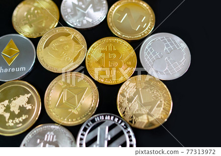 Different cryptocurrency coins on black background Different cryptocurrency coins on black background 77313972