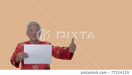 Asian seniior elder man in Chinese new year red costume holding white board space for holiday sale Asian seniior elder man in Chinese new year red costume holding white board space for holiday sale 77314129