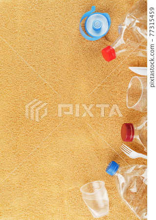Plastic trash on a sandy beach with Trash from plastic bottles on a sandy beach with free space. Plastic trash on a sandy beach with Trash from plastic bottles on a sandy beach with free space. 77315459