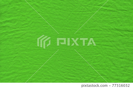 Closeup green fabric surface. Natural green linen texture Closeup green fabric surface. Natural green linen texture 77316032