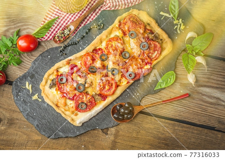 Parmesan salami long pizza on wooden board. Pepperoni and peppers over cheese pizza. Space for text. Parmesan salami long pizza on wooden board. Pepperoni and peppers over cheese pizza. Space for text. 77316033