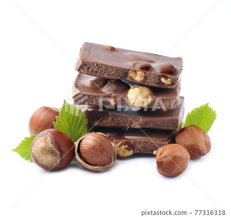 Chocolate with nuts on white backgrounds 77316318