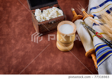 Symbols of jewish holiday Shavuot torah and shofar old red background. Symbols of jewish holiday Shavuot torah and shofar old red background. 77316983