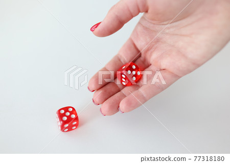 In hand are red cubes with numbers In hand are red cubes with numbers 77318180