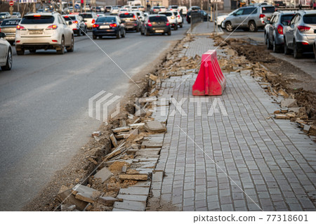 Pavement damage with cracks at street and many cars Pavement damage with cracks at street and many cars 77318601