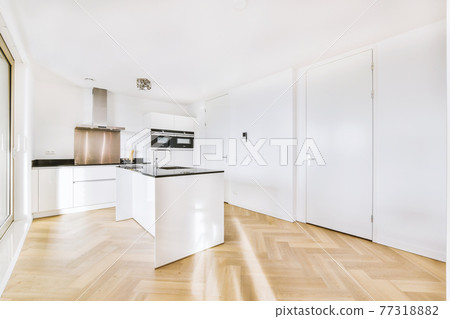 Interior of modern kitchen with white furniture 77318882