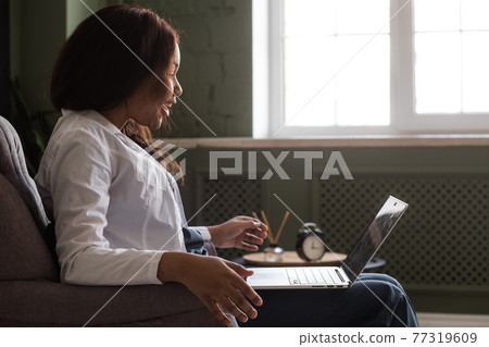 telehealth with virtual afro American doctor appointment and online therapy session. Black doctor online conference 77319609