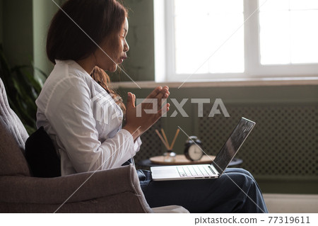 telehealth with virtual afro American doctor appointment and online therapy session. Black doctor online conference 77319611