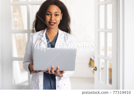 telehealth with virtual female doctor appointment and online therapy session. Black female doctor online conference  77319910