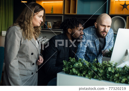 business meeting. Discussion of the start-up of the project. Young multiracial programming team business meeting. Discussion of the start-up of the project. Young multiracial programming team 77320219