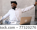 Funny bored at work african american doctor worker falling asleep at office desk, employee sleeping at workplace near laptop feel overworked concept 77320276