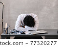 Funny bored at work african american doctor worker falling asleep at office desk, employee sleeping at workplace near laptop feel overworked concept 77320277