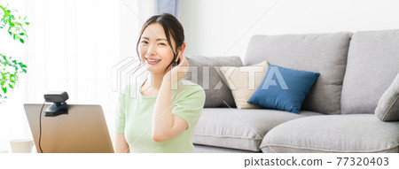 Woman doing telework at home 77320403