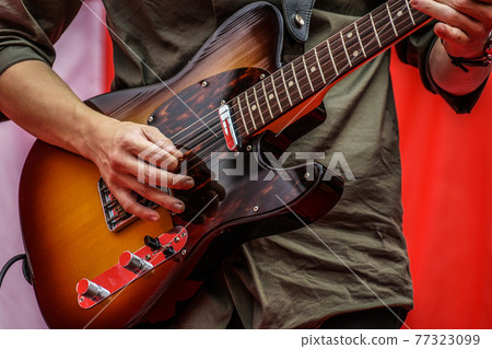 Image of person playing guitar Image of person playing guitar 77323099
