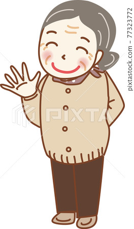 An energetic grandma waving her hand. 77323772