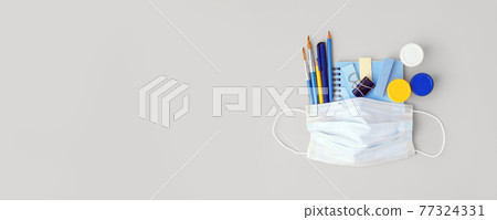 Distance learning concept, School, freelance, office tools and medical face mask. Concept social distance, distance learning, home education, coronavirus, quarantine, lockdown, new normal 77324331