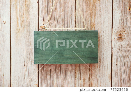 Empty wooden board hanging on wooden background Empty wooden board hanging on wooden background 77325436
