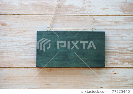 Empty wooden hanging on wooden background Empty wooden hanging on wooden background 77325440