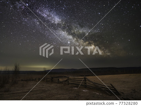 Starry milky way sky over farm field. Starry milky way sky over farm field. 77328280