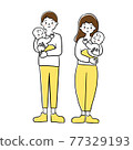 Dad and mom holding a baby 77329193