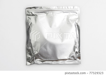 Foil bag package isolated on white background. Silver aluminium metallic foil doypack, packaging pouch with zipper Foil bag package isolated on white background. Silver aluminium metallic foil doypack, packaging pouch with zipper 77329323