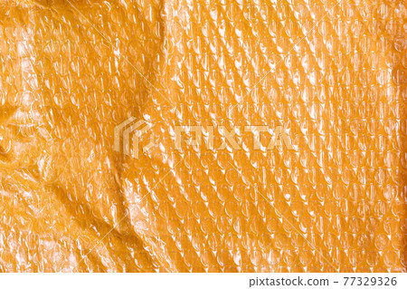 Small yellow post packet packaging texture. Plastic bubble wrap background 77329326