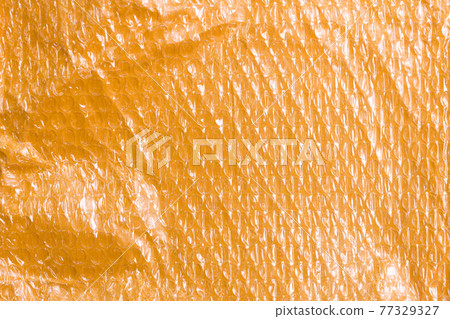 Small yellow post packet packaging texture. Plastic bubble wrap background 77329327