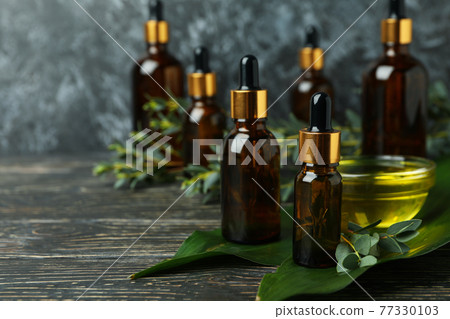 Concept of natural cosmetics with eucalyptus oil on wooden table 77330103