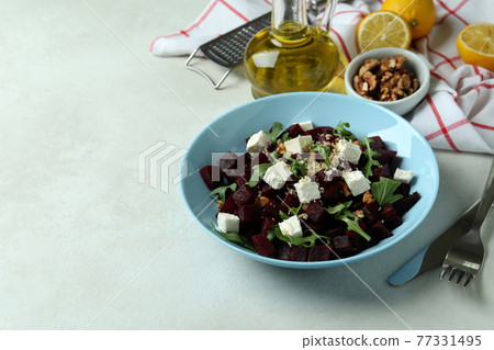Concept of tasty eating with beet salad on white textured table 77331495