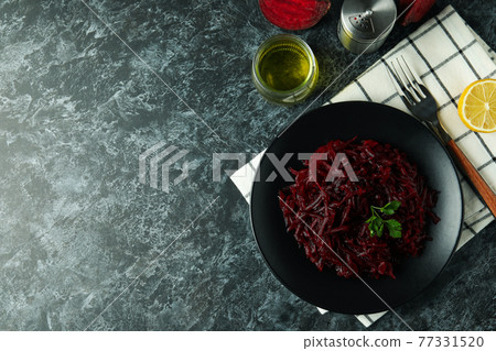 Concept of tasty eating with beet salad on black smoky table Concept of tasty eating with beet salad on black smoky table 77331520