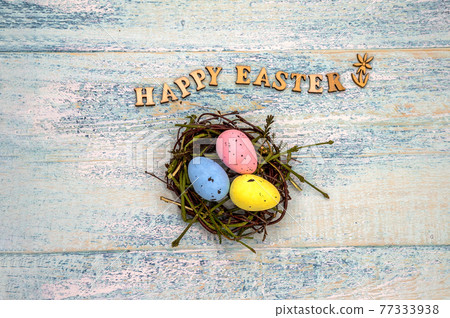 Easter eggs in the nest. Holy Easter. Blue turquoise background. Happy Easter 77333938